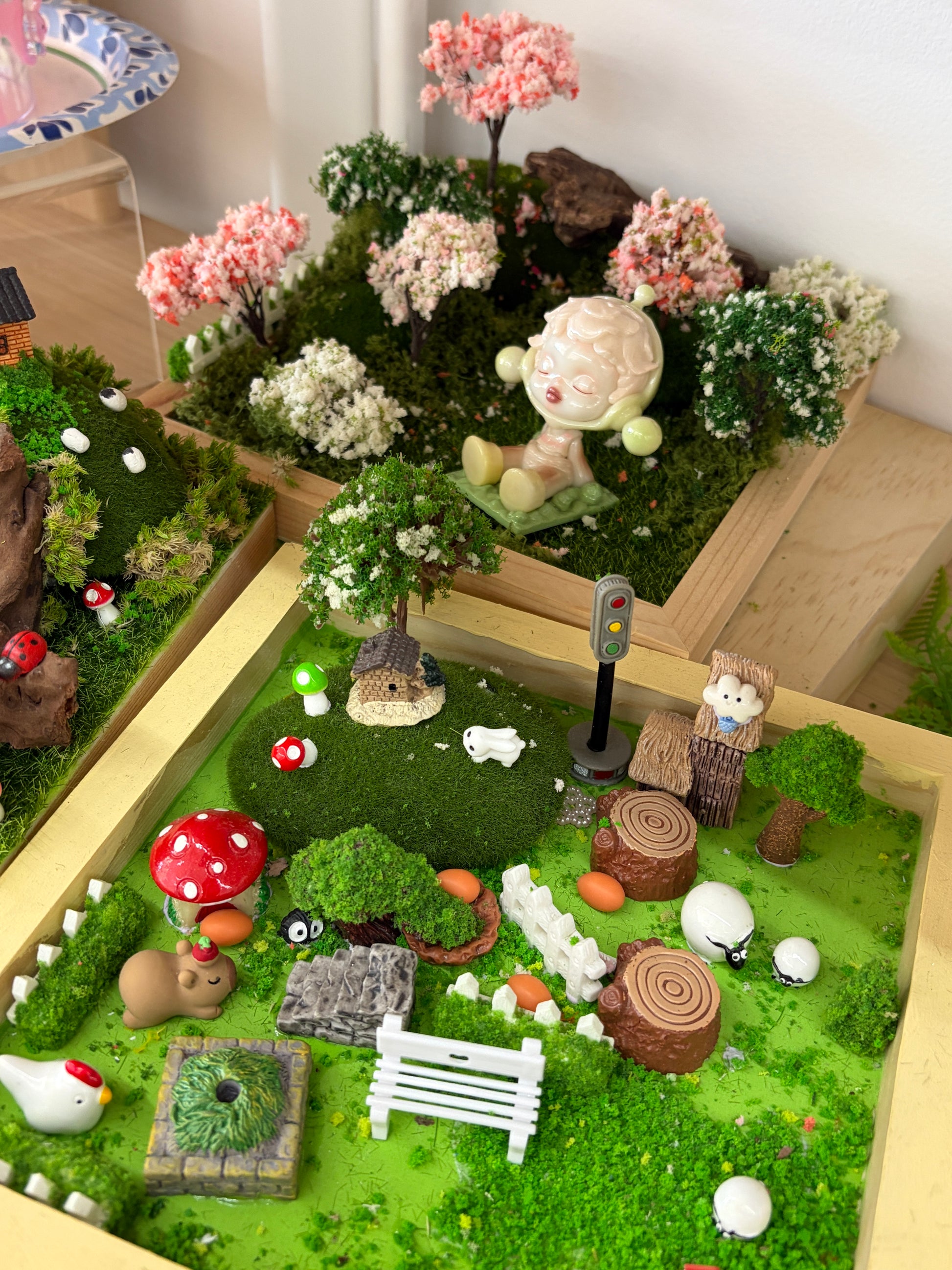 Handmade miniature moss landscape with wood base and decorative charms at XPOP Art Craft Lisle IL